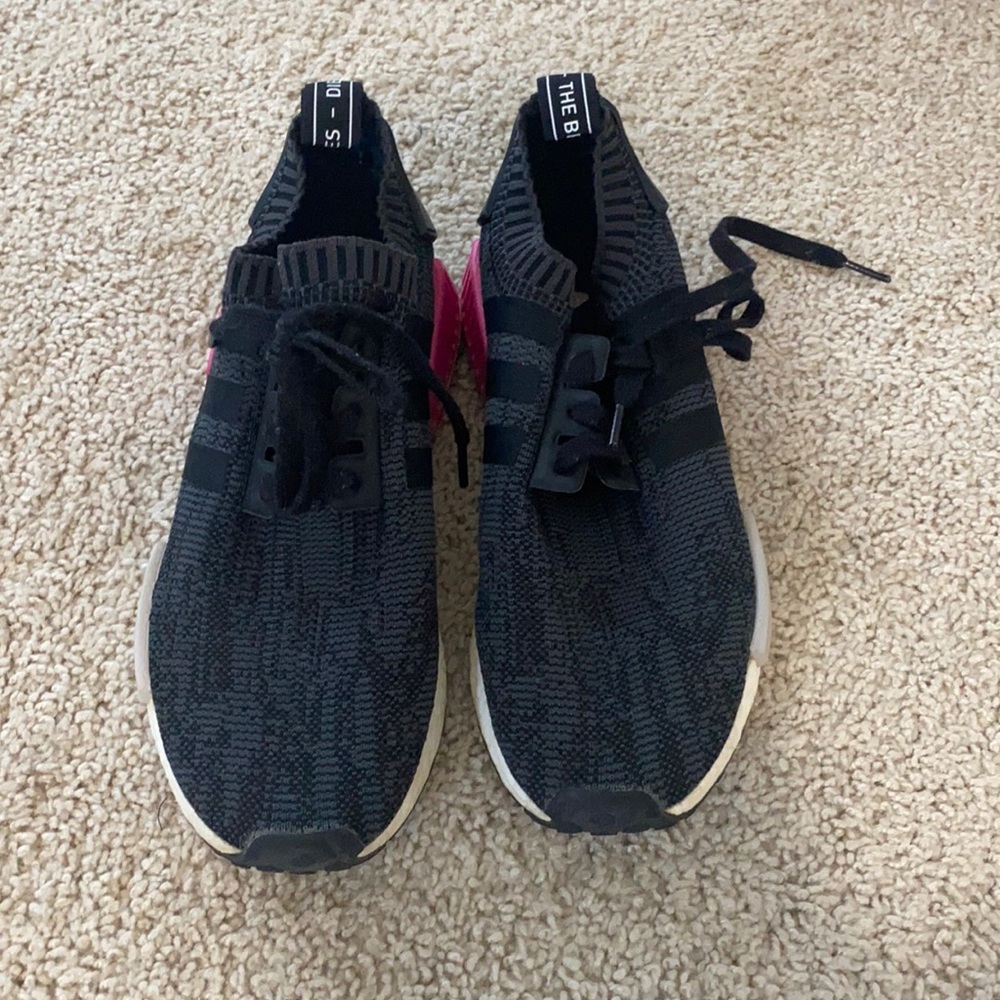 Pink and black Adidas NMD’s